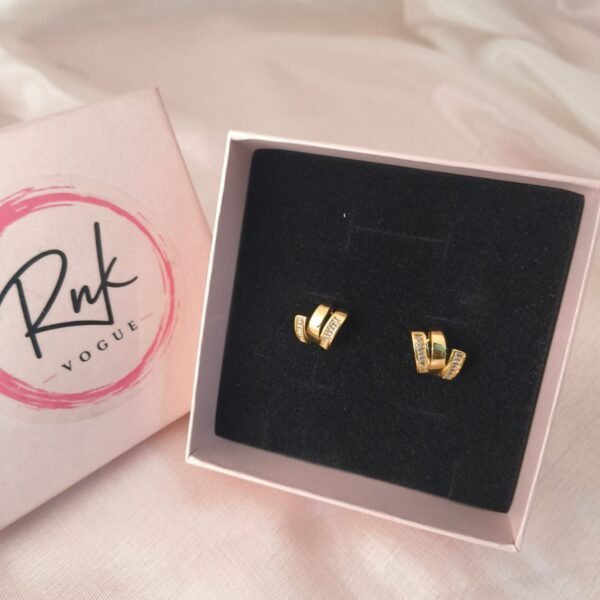 Gold baguette crystal wrap huggie earrings in RNK Vogue gift box